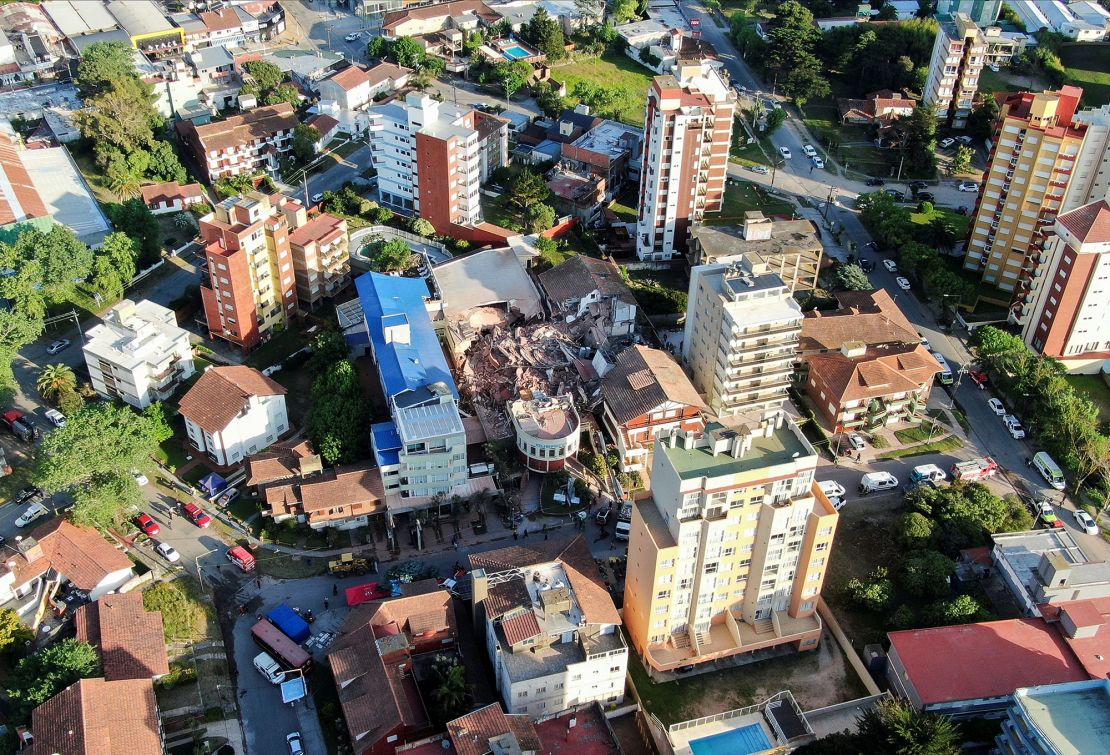 Emergency workers are trying to free up to nine people believed to be trapped in the rubble.